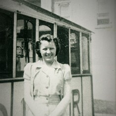 MOM STANDING IN FRONT OF THE DINER SHE WORKED AT