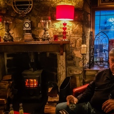 Resting by the fire in a Scottish pub.