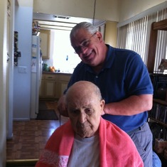 Allan gives Daddy a haircut.
