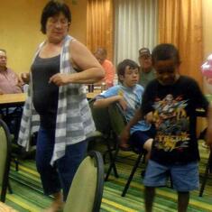 Dee dancing with grandson Khristian
