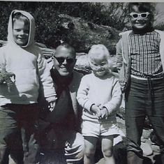 Deane with his kids:  Andy, Teresa, and Pam at the beach in 1960s.