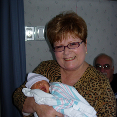 Holding grandson Kai for the first time