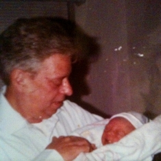 Delmas holding his first grandchild, Anna