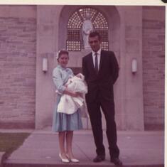 Denise and Frank holding Marty  /  Marty's Godparents .