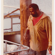 Dennis Lane grilling at Sausalito dock c 1982