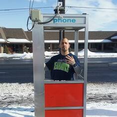 Derrick in a old phone booth