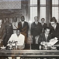 Desmond Luke, Minister of Foreign Affairs, at a signing ceremony, w John Bankole-Jones.  Photo kindly provided by the family of the late John Bankole-Jones