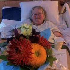 Diana receives a bouquet of flowers while in the hospital.