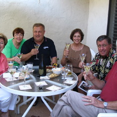 Sheila Giacomini, Carole, John Junge, Sandy Adams, Jack Giacomini and Dick toasting in Whispering Palms.