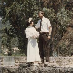 7th Anniversary August 9, 1984, on the old stone bridge.  Same man, same woman, same wedding dress, same bridge - lots more love and happiness!!!  Praise the Lord!
