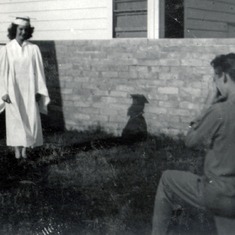 1947 Don taking photo of Ginny graduation gown