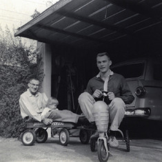 1 May 1959 Silly boys! Don on tractor and his father, Louis and Connie Lou in the wagon.