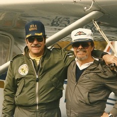 Don and friend with their co-owned airplane.