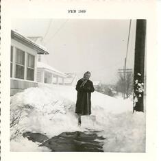 Don's mother, Helen, outside their family home after a large snowstorm in 1960.