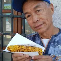 Dad eating corn