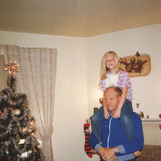 On dad's shoulders 1987: Dad used to always laugh because anytime he put me on his shoulders and bent forward, I'd hold on tight and groan. I never have liked heights!