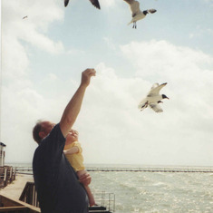 Feeding seagulls: Rockport, Tx (2002) One of my favorite pictures of Dad and Matthew. Matthew would take a piece of bread, act like he was throwing it to the seagulls and instead stuff it in his mouth :)