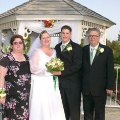 Dad, Mom, Brandi, and I at mine and brandi's wedding