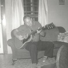 My Father Doing What he Always Loved 
Playing his guitar