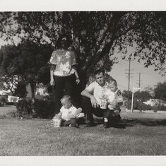 Nancy, Michael, Donald and Ray Hill Easter baskets under a tree