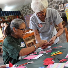 Doreen helping make valentines with adults Service Project Friends of Our Cabana Feb. 2012