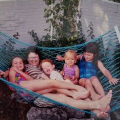 Katie, Simon, Samantha and Emma in the hammock with their Bubbi