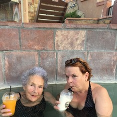 Darlene and Doris sitting in the hot spring in Pagosa drinking smoothies.