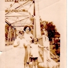 With her mom and brother John. Back of photo says 1937 but I don't recognize the bridge. Anyone?