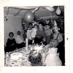 First Bday Party 1960. One of many parties in the basement of our home on 78th Street in Brooklyn. Steven was 4 - see his fingers? LOL. At left were our upstairs tenants, Gracie & Eddie.
