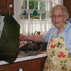 Gram with the banana leaf that she was going to wrap her pork roast in!  The kitchen was a place for adventure.