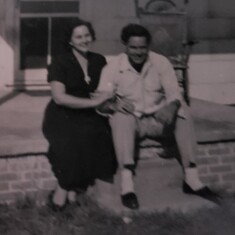 Mom and Dad in front of their first home.