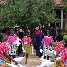 children lead graduation procession