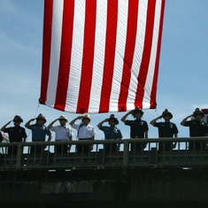 Procession to funeral home - firefighter salute on overpass
