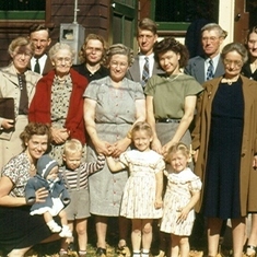 Doug with mother, baby sister, cousins, aunts, uncles, grandmother, and other family