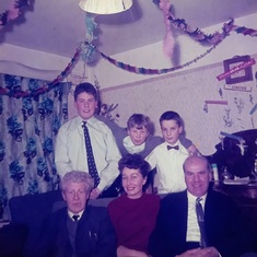 Christmas 1966. Doug with sister-in-law Doreen and brother Ron. BR. Michael, Bill and Paul Thompson.