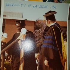 Dr. Ndukwu delivering speech with President of University of Laverne California.