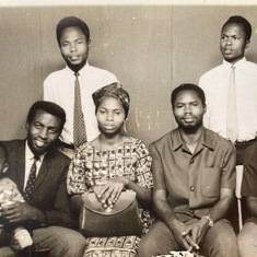 Dr. Ezeilo with his siblings and brother-in-law (far left) holding his nephew. 