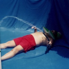 From Dianne's Photo Wall - Some Favorites - Keith filling the above ground pool in Californial.