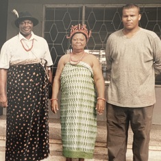 Daddy and his son Dele Oshodi flanking his sister at a ceremony in Benin.