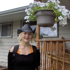 Andrea by our front deck - on their way to the Calgary Stampede???