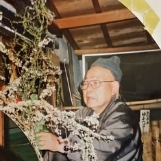 Dad arranging floral for Mom's inurnment service