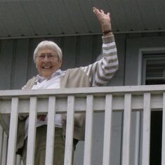 Fulton waving good-bye from her balcony on Salt Spring Island. Photo by Margo McMahan, 2007