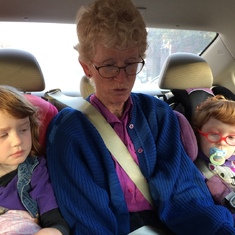 Reading to the granddaughters in the car - a frequent activity. Nov 2016.