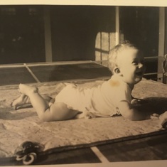 Baby Edwenna on a ping pong table.