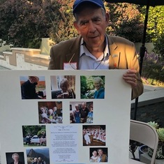 MIchael with photomontage of Edwenna displayed at Swing Left event in her honor