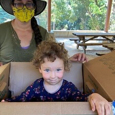 Rose [aged 2 1/2] in the box, mother Karen behind, September 2021