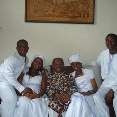 Dad with kids and son-in-law all in white on 80th birthday