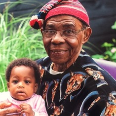 Dad and granddaughter, Chimdalu