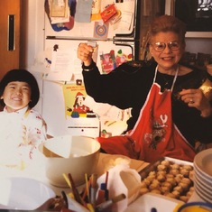 Eve and her Grammy making Christmas cookies