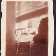 Infant mom in hi chair 1924